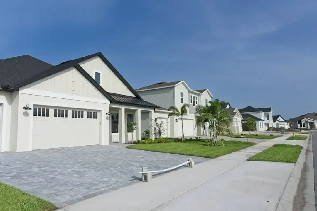 New homes with wide driveways on a quiet street